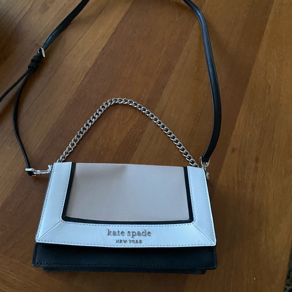 Cute Kate Spade, barely used because of a small dent.